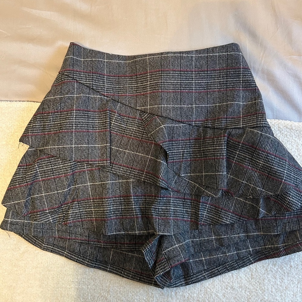 Black, grey, and red plaid skort